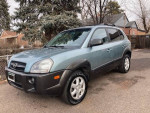 2005 Hyundai Tucson SUV in good condition with new tires and sunroof, priced at $5167.