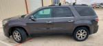 2013 GMC Acadia SLT in gray with clean leather interior and roof rack, ideal for families and daily driving.