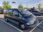 1993 Toyota Previa LE minivan parked, ideal for camping trips with spacious interior and storage.
