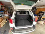 Interior view of the 2014 Fiat 500L Trekking showing spacious rear cargo area and seats folded down.