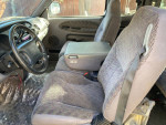 Interior view of a clean 1998 Dodge Ram 1500 SLT with fabric seats and steering wheel
