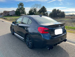 2018 Subaru WRX in grey with manual transmission parked on the roadside, showcasing its sporty design and clean exterior.