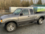 2007 Mazda B4000 with 112,000 miles, in excellent condition, parked on a gravel surface