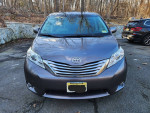 Front view of a 2011 Toyota Sienna Limited in gray with a clean design and polished finish.