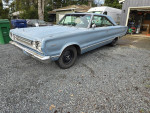 1967 Plymouth Satellite with factory A/C, original and upgraded 383 engine, parked on gravel.