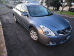 2012 Nissan Altima S Model in silver with 97,000 miles, great condition, ideal first car.