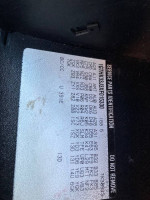 Service parts identification label for a 1999 GMC SLE K3500 truck with 92,000 miles.