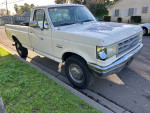 1991 Ford F250 Super Duty Long Bed truck with 7.5L engine parked on street
