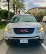 Front view of a 2012 GMC Acadia SLE, a spacious SUV for sale in great condition with 133,000 miles.