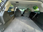 Interior of a 2012 GMC Acadia SLE with spacious cargo area and seats folded down.