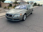 2008 Volvo V70 3.2 FWD wagon with low mileage parked on a residential street, showing its sleek design.