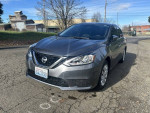 2017 Nissan Sentra in excellent condition, 126,000 miles, gas saver with 37+ MPG, gray sedan parked on the street.