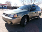 2004 Subaru Outback AWD wagon in green color with alloy wheels, low mileage, and salvage title.