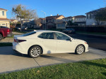 2021 Toyota Avalon parked on a driveway, showcasing its sleek design and pristine condition.