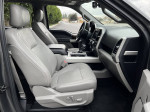 Interior view of a 2017 Ford F-150 Lariat showcasing leather seats and modern dashboard features.