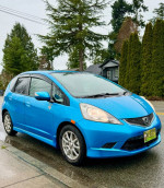 2009 Honda Fit Sport in blue, low mileage, well maintained, features Apple CarPlay, and new winter tires.