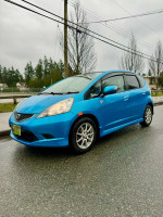 2009 Honda Fit Sport in blue, right-hand drive with low mileage, clean title, and Apple CarPlay features.
