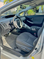 Interior view of a 2015 Toyota Prius showing seats and dashboard features in excellent condition.