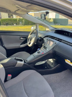 Interior view of a 2015 Toyota Prius with comfortable seating and modern dashboard features.