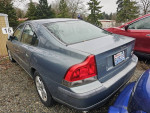 2002 Volvo S60 2.4 Sedan parked in a repair shop yard with good body condition and clean title.