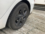 Close-up of a 2022 Hyundai Elantra's black wheel with new Michelin X3 snow tire.
