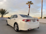 2010 Acura TSX in white pearl, parked with palm trees, featuring excellent condition and clean title.