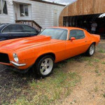1970 Chevrolet Camaro Z-28 in bright orange, showcasing its classic design and performance features.