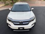 Front view of a white 2019 Honda Pilot EX SUV with 135,000 miles for sale, featuring a 3rd row seat.