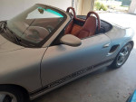 1997 Porsche Boxster convertible with red leather interior, clean title, and garage kept.