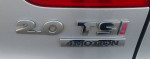 Close-up of the 2.0 TSI 4Motion badge on a 2013 Volkswagen Tiguan S, highlighting its AWD capabilities.