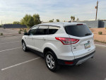 2013 Ford Escape SE FWD parked outdoors, showcasing sleek design and new tires.