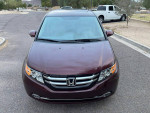 2016 Honda Odyssey SE minivan in burgundy color, front view, available for sale with 95,000 miles.