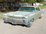 1964 Cadillac Sedan DeVille 4 Door Hardtop with big block 429 V8 motor, rust-free exterior and original hub caps.