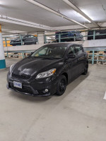 2011 Toyota Matrix for sale, black exterior, winter tires, manual transmission, well-maintained, 106,000 miles.