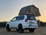2008 Lexus GX 470 4WD in pearl white with rooftop tent, perfect for off-road and camping adventures.
