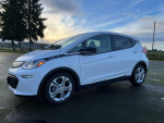 2019 Chevrolet Bolt EV parked outdoors, ideal electric commuter car with great features and low mileage.