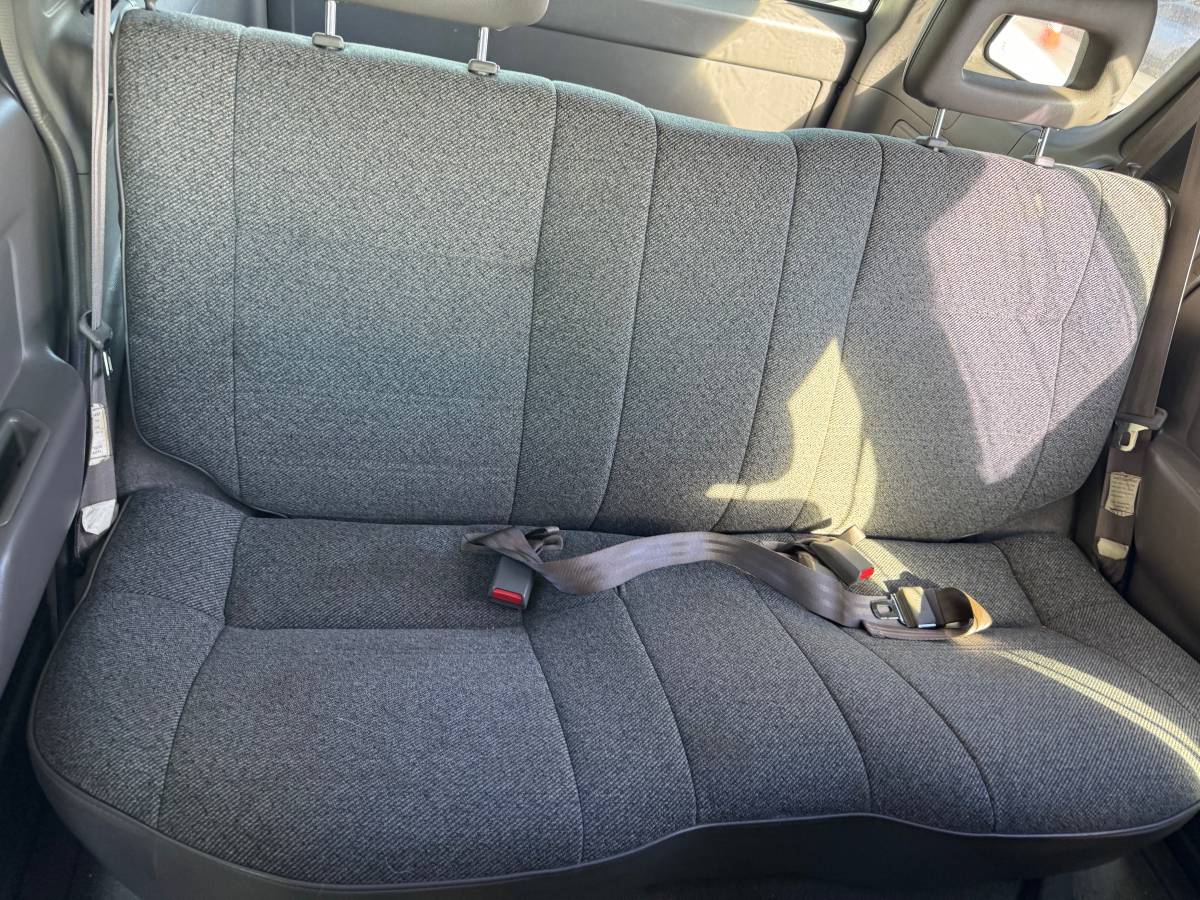 Interior view of a Honda Passport showing clean and spacious rear seats, ideal for comfortable rides.