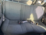 Interior view of a Honda Passport showing clean and spacious rear seats, ideal for comfortable rides.