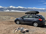 2012 Subaru Impreza 2.0i hatchback with Yakima skybox in a mountainous landscape