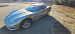 2005 Chevrolet Corvette C6 in silver metallic with ebony interior, showcasing low mileage of 57,000 miles