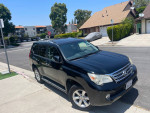 2010 Lexus GX 460 4WD parked on the street with clean exterior and minor cosmetic issues.