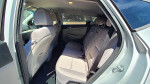 Interior view of a 2018 Hyundai Tucson showing spacious back seat area in excellent condition