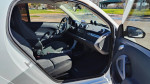 Interior view of a 2015 Smart Fortwo Electric Drive, showcasing seats and dashboard details.