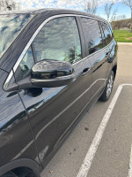Side view of 2019 Honda Pilot EX-L SUV parked, showcasing its sleek exterior design and chrome accents.