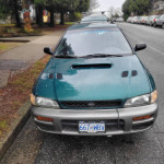 Front view of 1997 Subaru Impreza Outback Sport AWD parked, showcasing unique styling and condition.