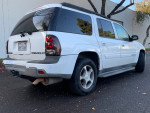 White Chevrolet TrailBlazer, 80,000 miles, clean exterior, seats seven, 4x4, ready for a new family