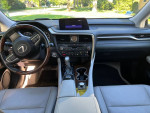 Interior view of a 2019 Lexus IS 350 with a sleek dashboard and wood accents