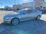 2010 Jaguar XF in silver, showcasing clean body and leather interior, parked outside in sunlight.