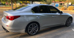 2015 Infiniti Q50 Sport in Liquid Platinum with alloy wheels parked in a residential area