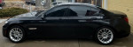 2013 BMW 750Li xDrive M Sport in black parked outside with sleek design and shiny alloy wheels